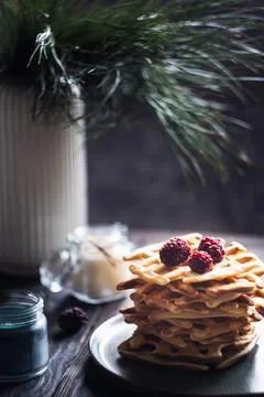 Belgian waffles stack with blackberries on top Stock Photos