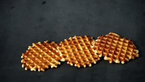 Belgian waffles. waffles on black background. sweet products. Stock Footage 99400985