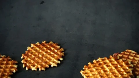 Belgian waffles. waffles on black background. sweet products. Stock Footage 99400997