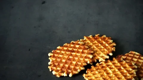 Belgian waffles. waffles on black background. sweet products. Stock Footage 99401012