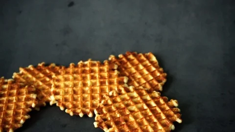 Belgian waffles. waffles on black background. sweet products. Stock Footage 99401019