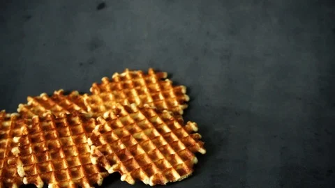 Belgian waffles. waffles on black background. sweet products. Stock Footage 99401024