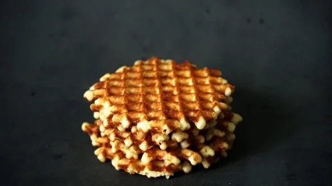 Belgian waffles. waffles on black background. sweet products. Stock Footage 99401046