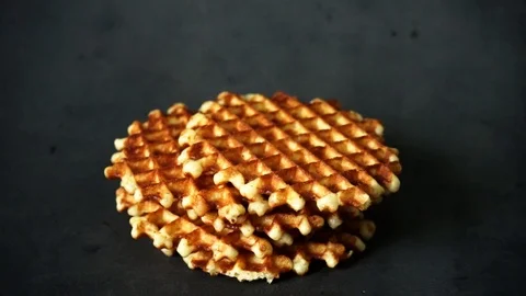 Belgian waffles. waffles on black background. sweet products. Stock Footage 99401049