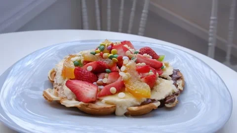 Belgian waffles on white plate background. Stock Footage 242069670