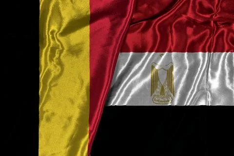 Belgium And Egypt Flags Draped Together On Black Background Symbolizing Diplomac Stock Photos