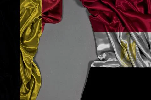Belgium And Egypt Flags Draped Together On Black Background Symbolizing Diplomac Stock Photos