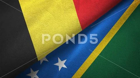 Belgium and Solomon Islands two flags textile cloth, fabric texture Stock Photos