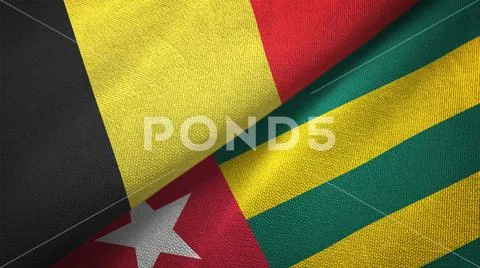 Belgium and Togo two flags textile cloth, fabric texture Stock Photos