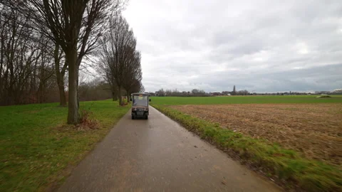 Belgium fields exploration in golf carts, front view 動画素材 331224046