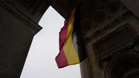 Belgium Flag under Arc De Triomphe In Parc Du Cinquantenaire, Brussels Stock Footage 128748059