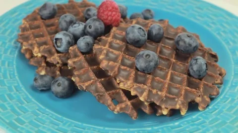 Belgium waffles with blueberries rotating Video stock 80647362