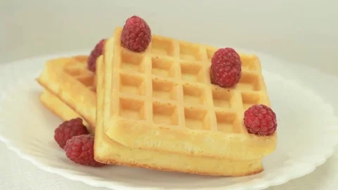 Belgium waffles with raspberries rotating Video stock 80646833