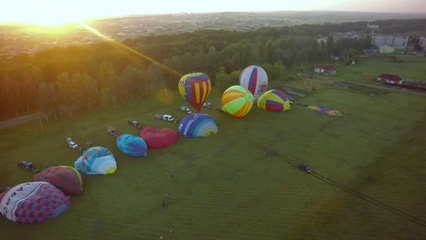 BELGOROD - AUG 4: Balloons fly up in sky with passengers over green field Stock-Footage 93397375