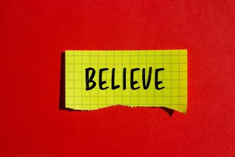 Believe message written on ripped torn paper background. Conceptual Believe.. Stock Photos