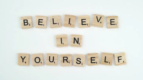 Believe In Yourself Written In Scrabble Blocks. 4k Shot Of Hand Placing Stock Footage 156364778