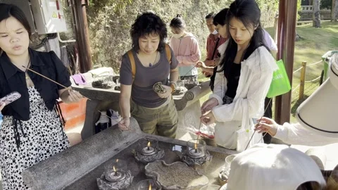 Believers light incense at Buddhist temple in Xiamen, China Stock Footage 255533595