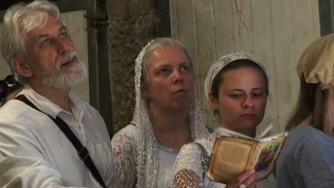 Believers visit the Jerusalem Temple of the Resurrection of Christ Video stock 115485145