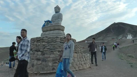 Believers walk in a circle around the statue of Buddha, Mongolia. Stock Footage 165691868