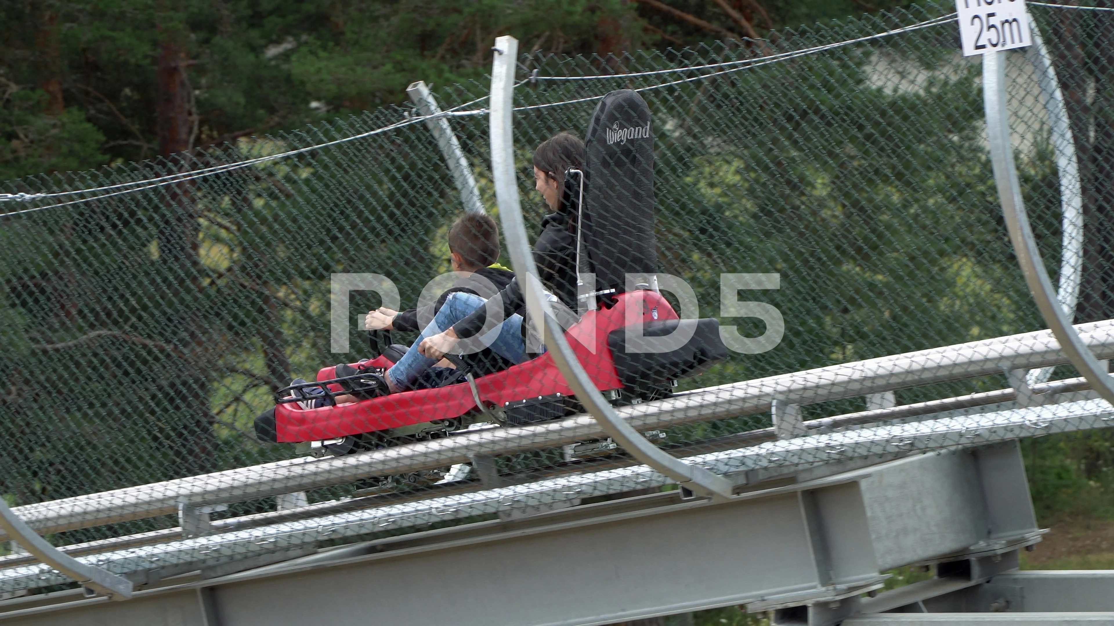 Belitsa Bulgaria 25 Aug 2019 People ride fast downhill rail trolley roll