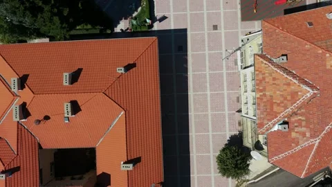 Belitsa town square aerial view over red tile roofs Bulgaria Stock Footage 346730284