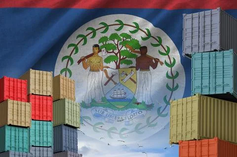 Belize flag and big stack of shipping cargo containers in docks with sky Fotos Stock