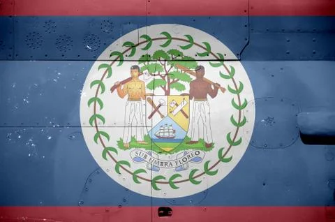 Belize flag depicted on side part of military armored helicopter closeup. Arm Stock-Fotos