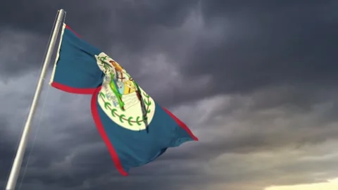 Belize flag waving on massive sunrise clouds at storm forecast background Stock Footage 267847845
