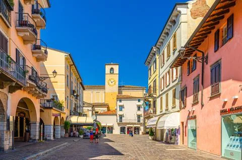 Bell and clock tower in old historical town Desenzano del Garda Stock Photos