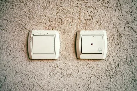 Bell and light buttons on the wall Stock Photos