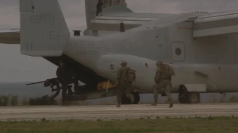 Bell Boeing V-22 Ospreys boarded by soldiers with rifles Stock Footage 113343130