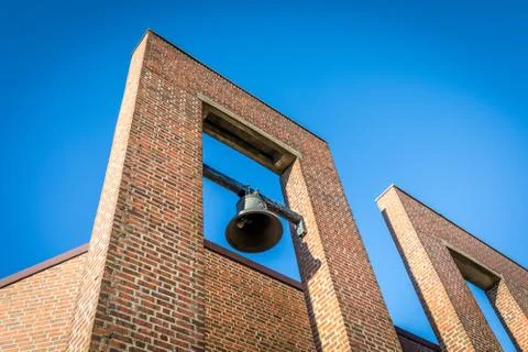 The bell at the chapel and crematorium in Oddernes, blue sky above, Kristiansand Stock Photos