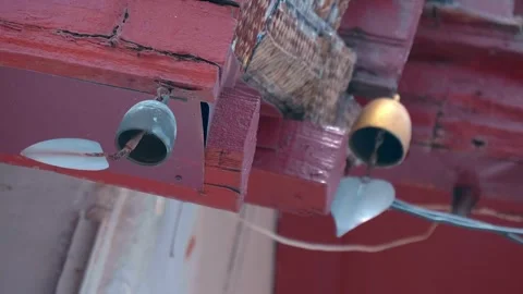 Bell clappers in the shape of Bodhi tree leaves flutter on the wind Stock Footage 308895400