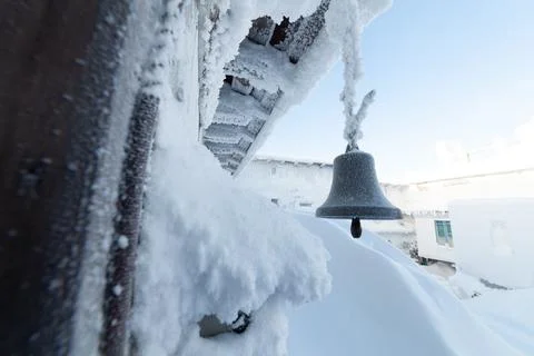 The bell dissolved. In a Buddhist temple in winter. Stock Photos