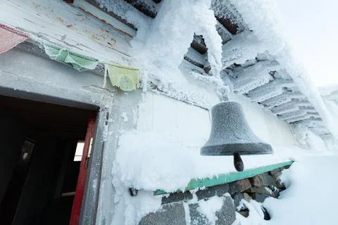 The bell dissolved. In a Buddhist temple in winter. Stock Photos