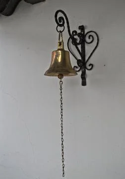 Bell hanging on wall Stock Photos