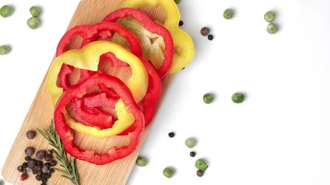 Bell pepper circle slice vegan snack healthy food serving wooden board Video stock 236761618