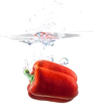 Bell Pepper Dropping Into Water Stock Photos