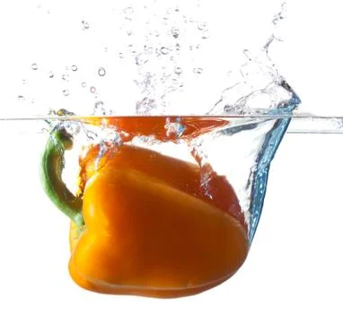 Bell Pepper Dropping Into Water Stock Photos