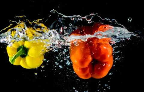 Bell Pepper falling in to water Stock Photos