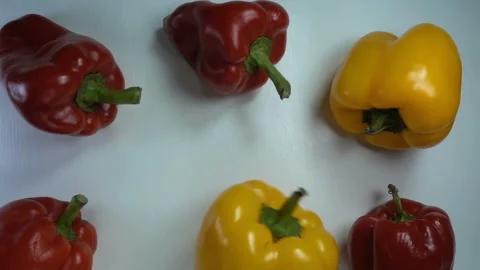 Bell pepper rotates in slow motion in heap of peppers Stock Footage 143423216
