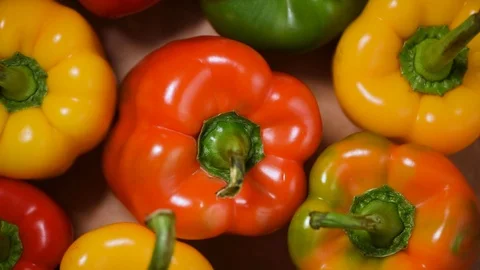 Bell peppers on rotating background. Top view. Vegan and raw food concept Stock Footage 125354426