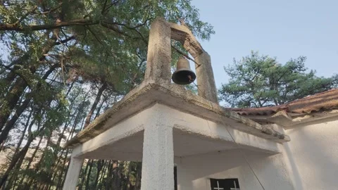 Bell Ringing By Rope At Small Orthodox Church Inside Pine Forest Video stock 326164836