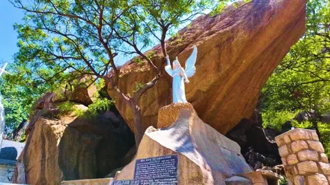 Bell Rock Along with a Statue - Leftwards Shot Stock Footage 263323369