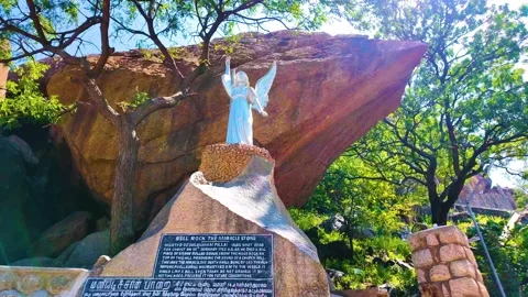 Bell Rock Along with a Statue - Rightwards Shot Stock Footage 263323562