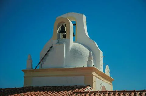 Bell on top of whitewashed dome in an old house Stock Photos