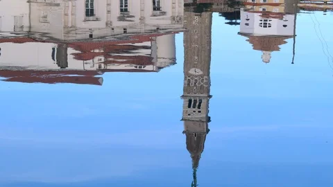 Bell tower and architecture of Old Town reflecting in wavy sea water. Stock Footage 100410889
