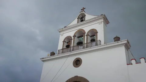 Bell tower and bells of chapel facade at Mision La Muralla with stone cross Stock Footage 344905716