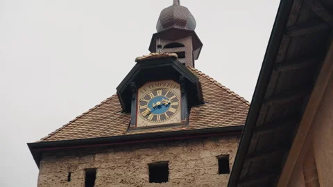 Bell tower and clock near Romainmotier Priory, former Cluniac priory, during Stock Footage 338055198