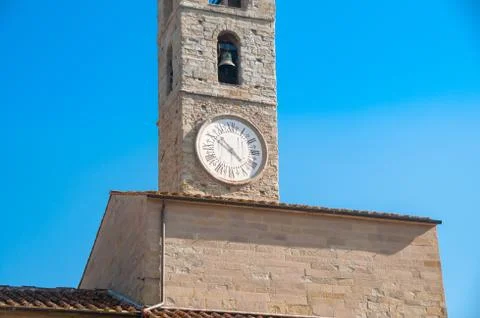 Bell tower with bell and clock with Roman figures Stock Photos